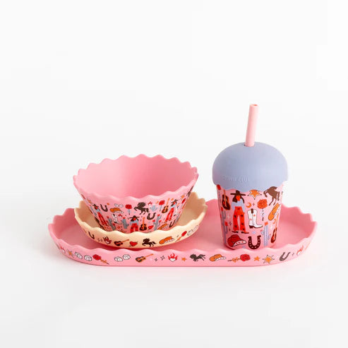 Set of pink cowgirl children's tableware with a bowl, cup, and straw on a white background