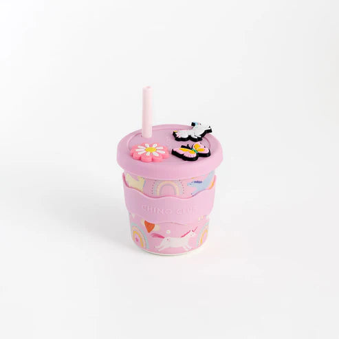 Pink tumbler chino cup with a straw and lid on a white background