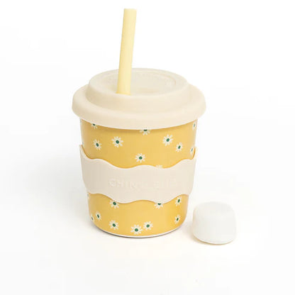 Yellow daisy cup with straw