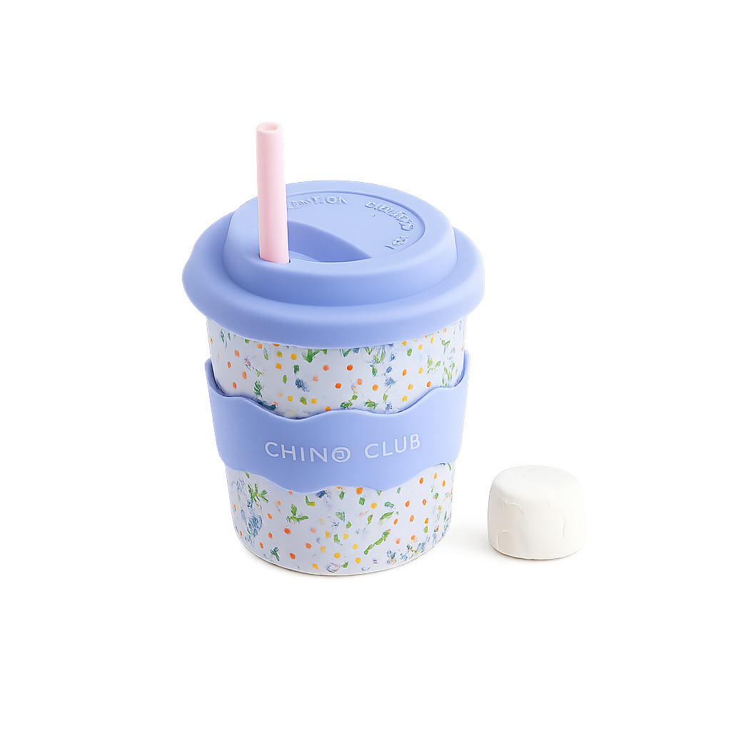 A melamine travel cup with a light blue lid and straw, a floral patterned body, a light blue carrying strap labeled 'CHINO CLUB', and a small white cap placed beside it on a white background.