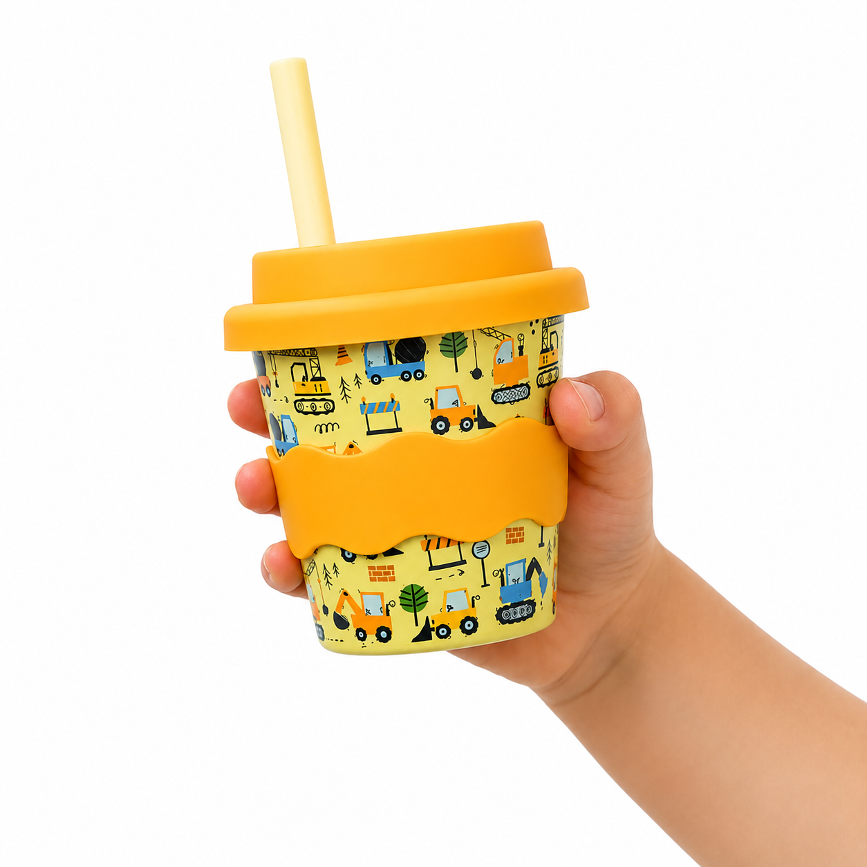 arm holding 4oz babychino cup with tractors and diggers
