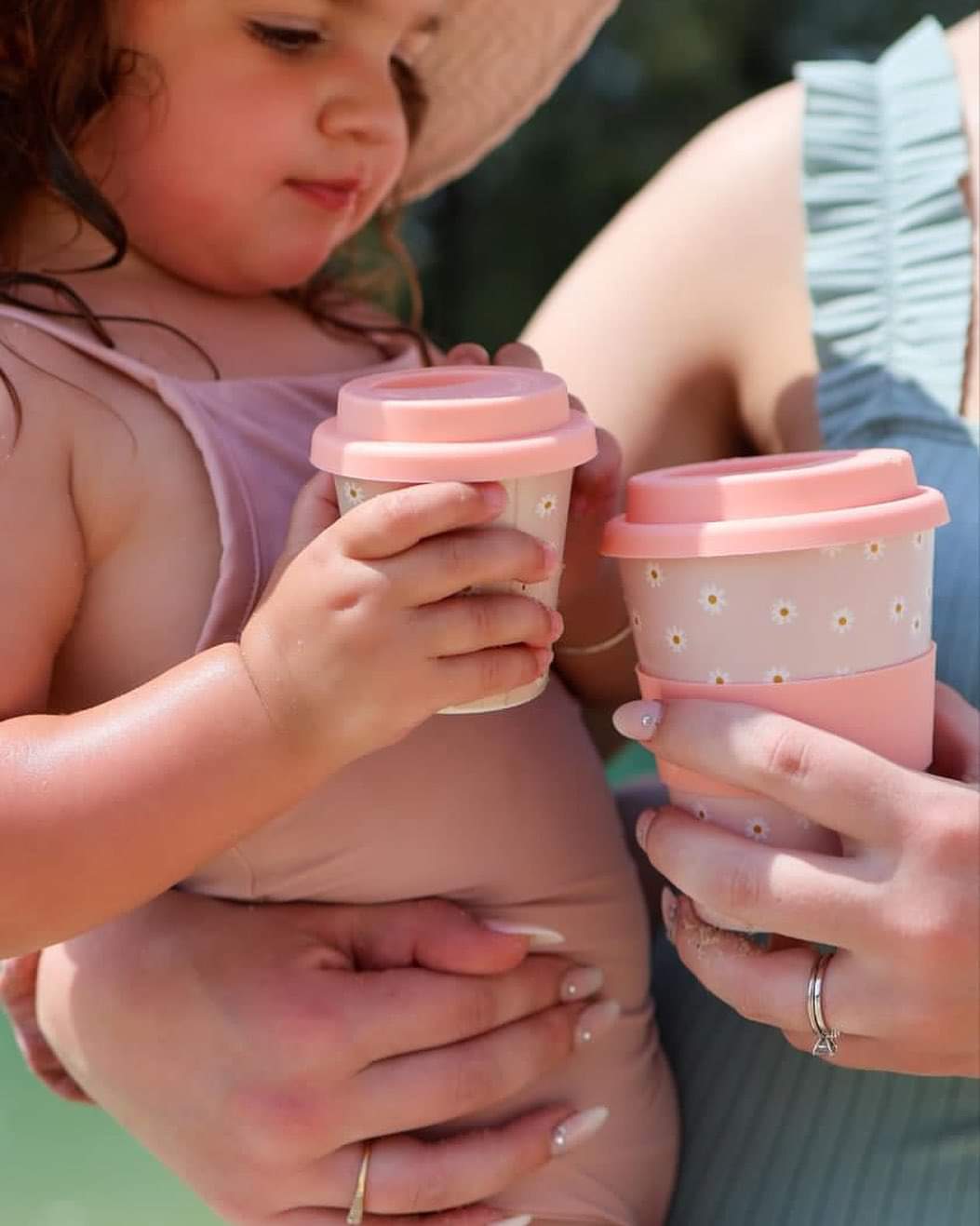 A pink daisy print babychino cup