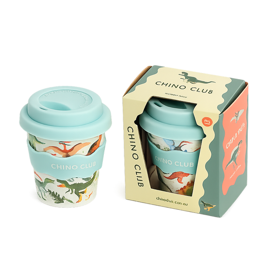 CHINO CLUB Dinosaur 4oz reusable babychino cup with matching gift box, featuring a fun dinosaur print, food-safe silicone lid and sleeve. A perfect gift for toddlers and young children.