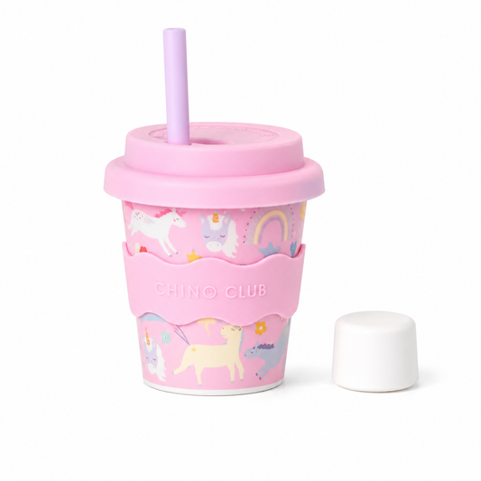 Pink unicorn reusable 4oz babychino cup with silicone lid, stopper straw and matching silicone sleeve by CHINO CLUB.
