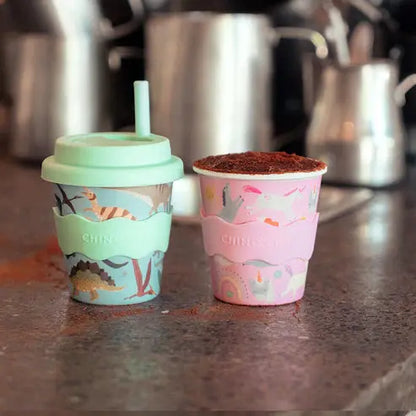 pink unicorn and green dinosaur babychino cups