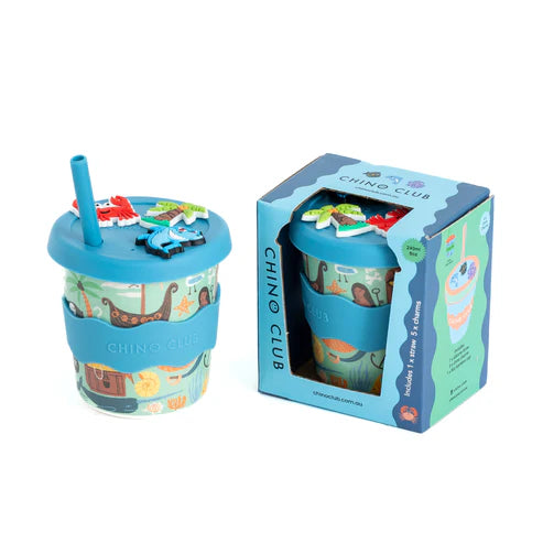 Children's blue cup with a straw and colorful design in packaging, branded 'Chino Club'.