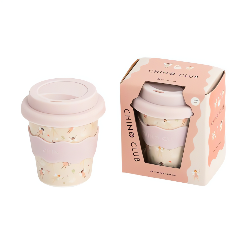 Reusable coffee cup with pink lid and floral design in packaging on a white background
