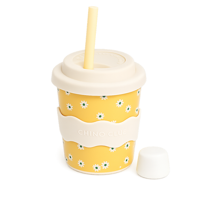 Yellow Daisy reusable 4oz babychino cup with silicone lid, stopper straw and matching silicone sleeve by CHINO CLUB.